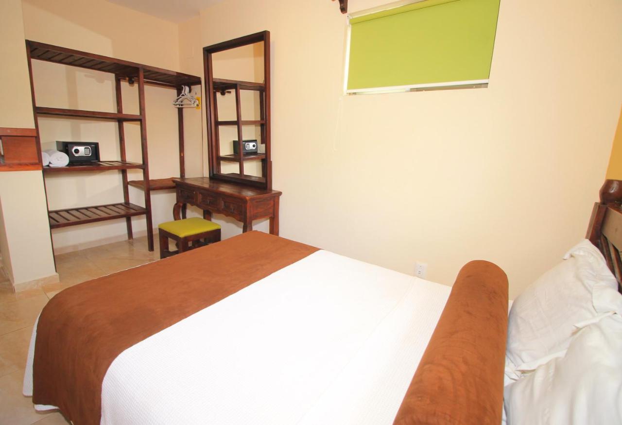 Papagayo Hotel Boutique Playa del Carmen Kültér fotó A bedroom at the hotel