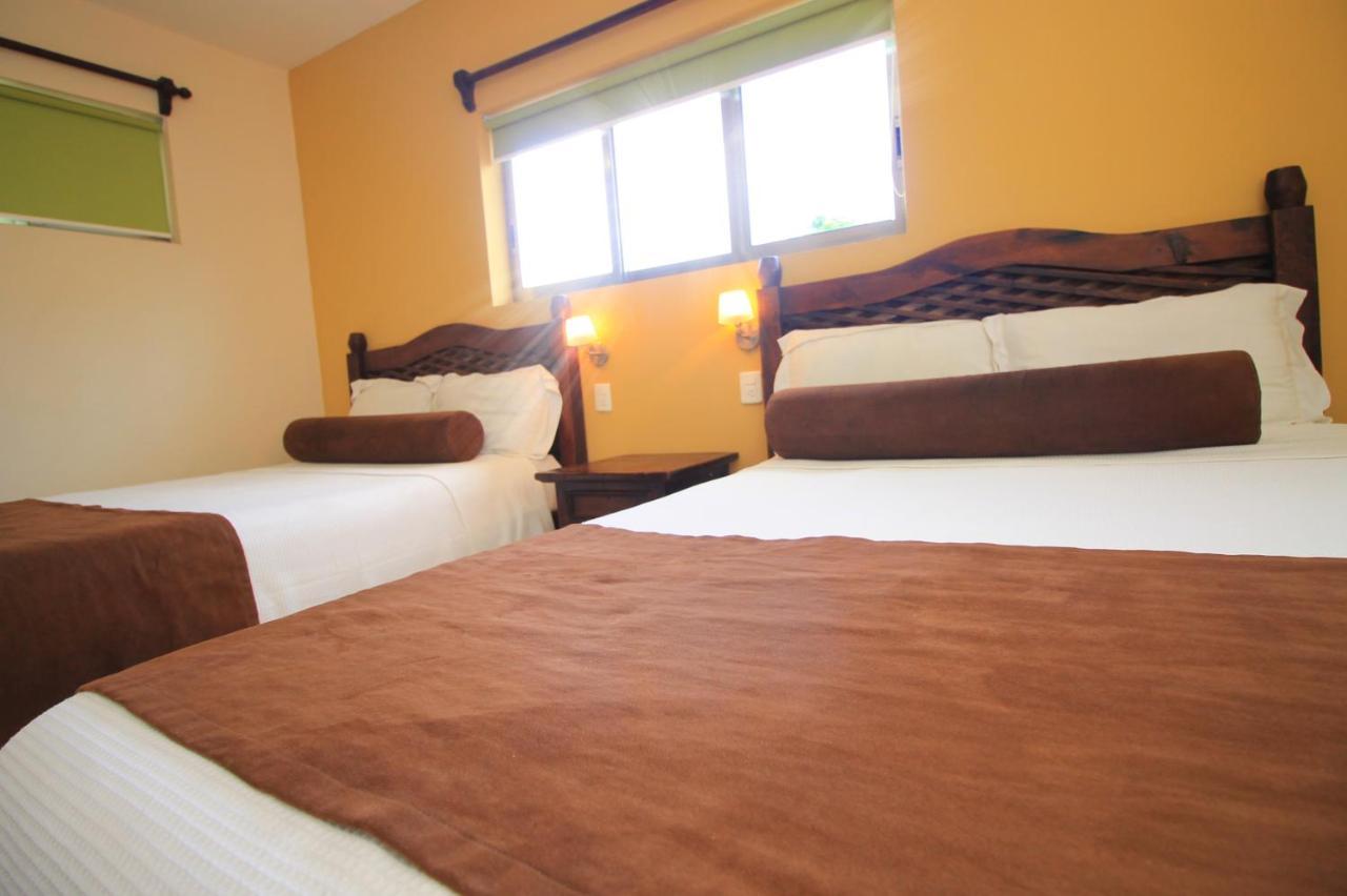 Papagayo Hotel Boutique Playa del Carmen Kültér fotó A room at the hotel
