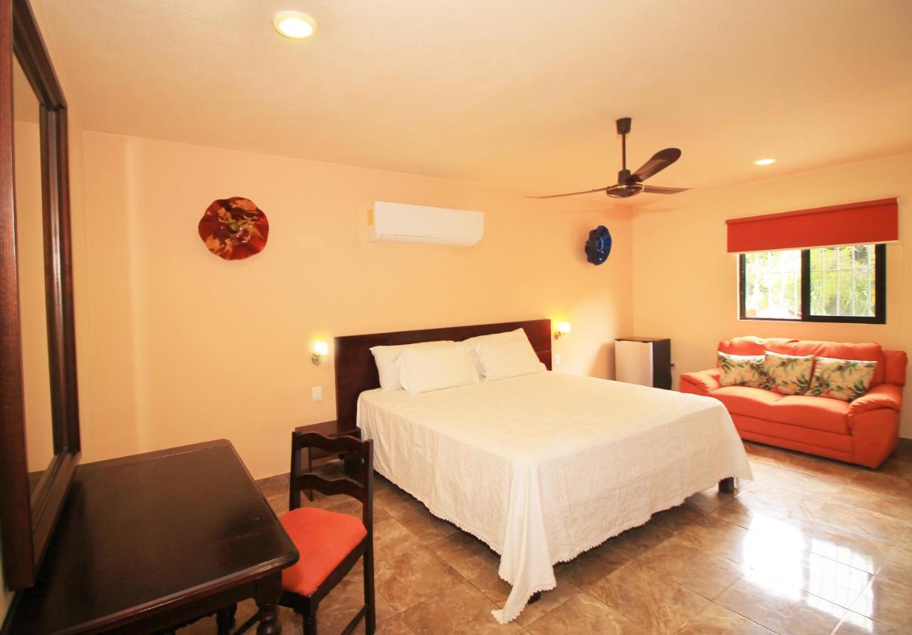 Papagayo Hotel Boutique Playa del Carmen Kültér fotó A bedroom at the hotel